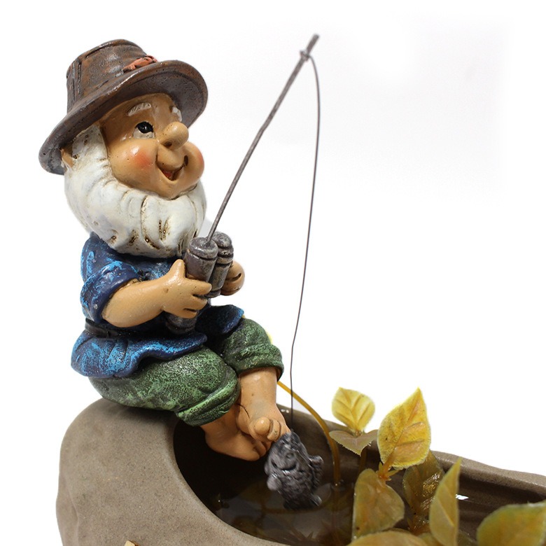Close-up of hand-painted gnome face and beard on planter rim