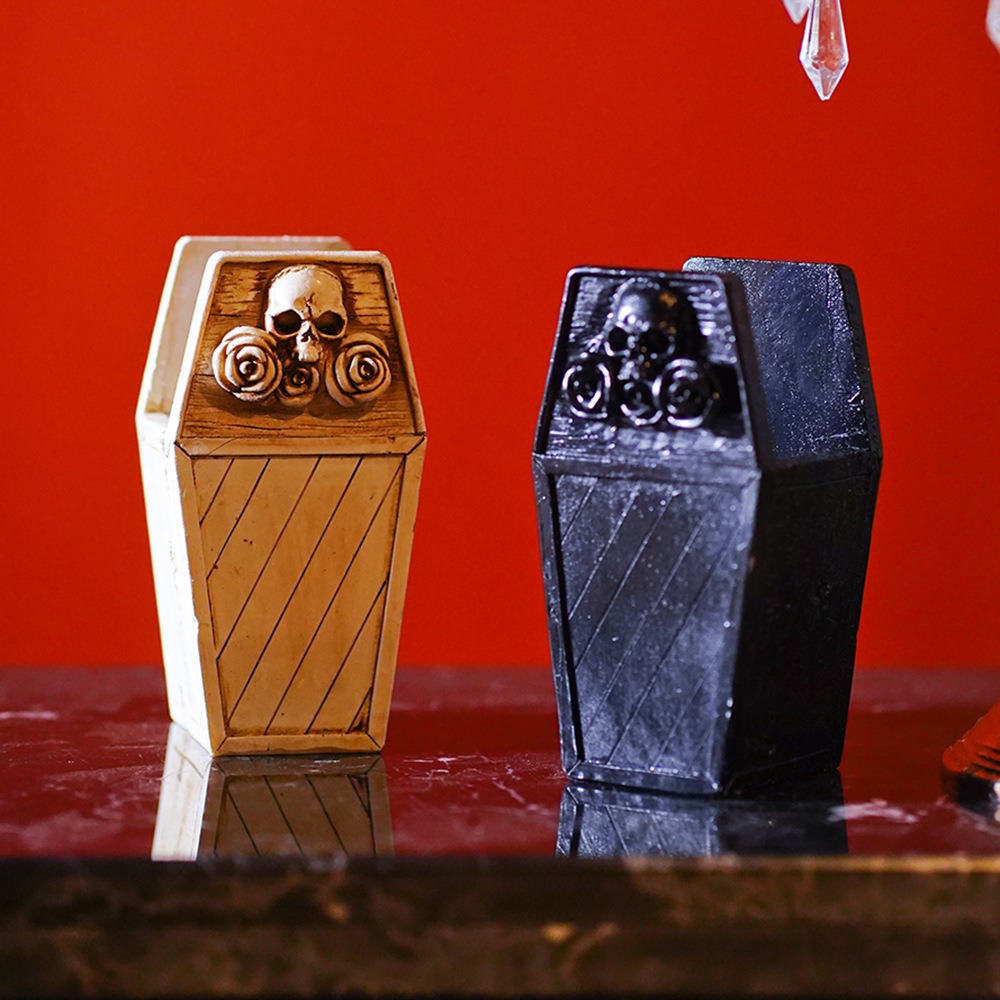 Aged cream and matte black coffin organizers side by side in a styled room