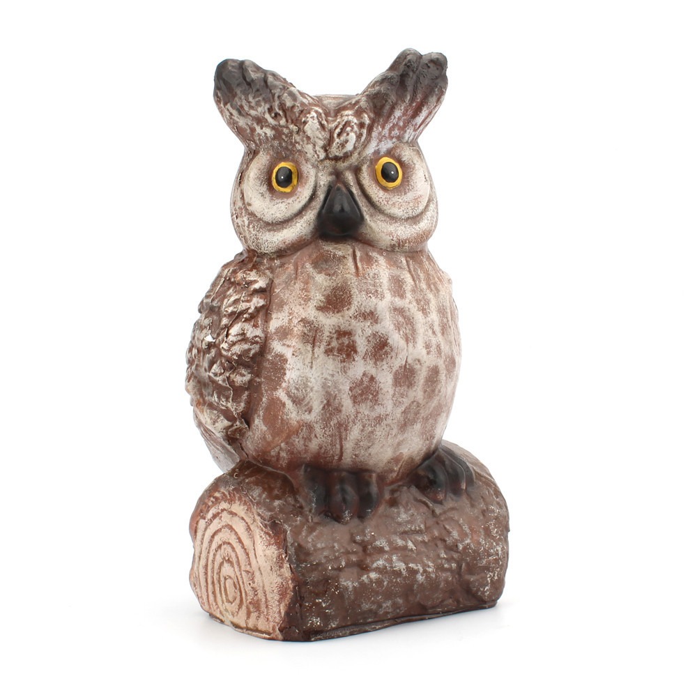 Owl on wood stump base with sculpted feathers and amber eyes