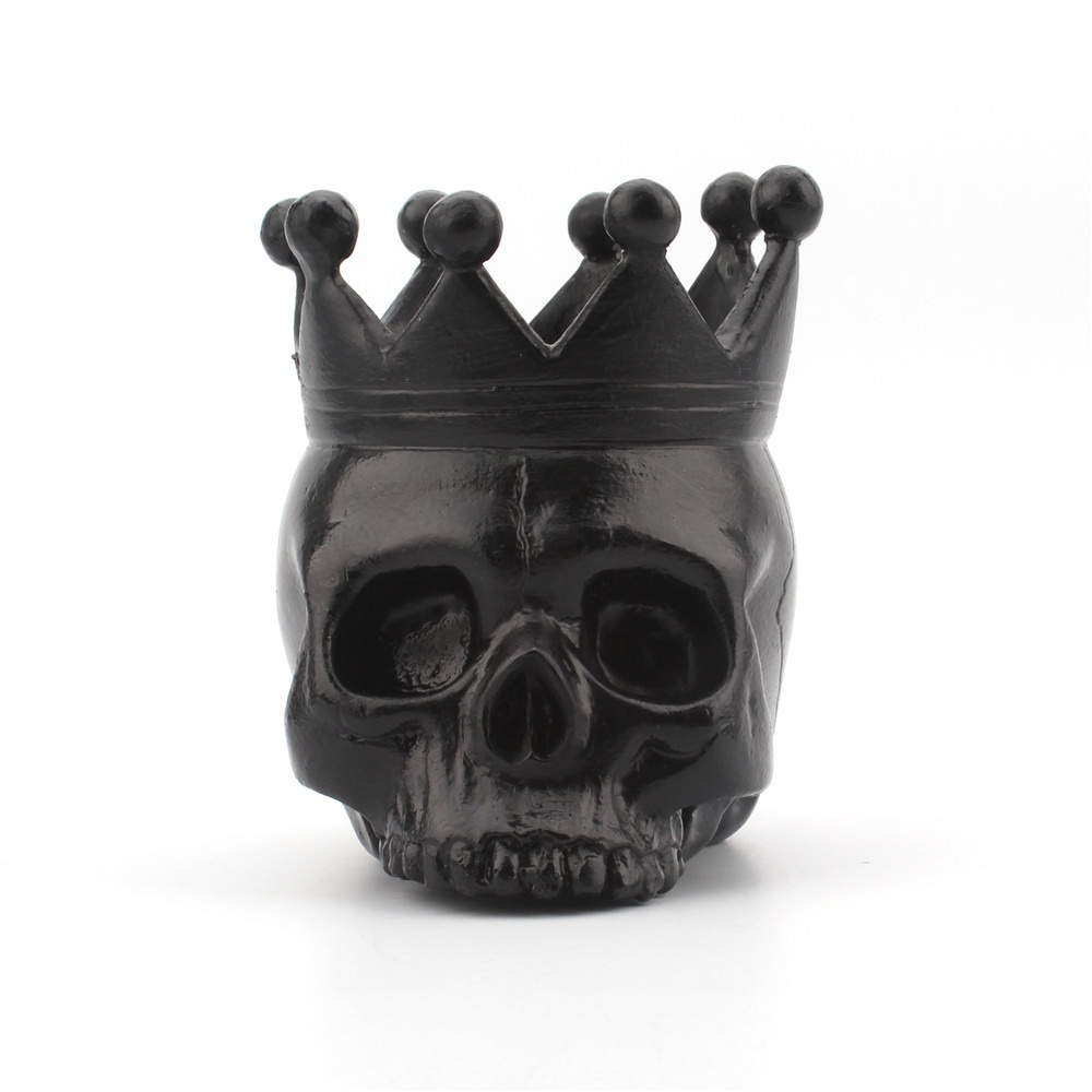 Matte black resin skull crown candle holder showing sculpted facial detail