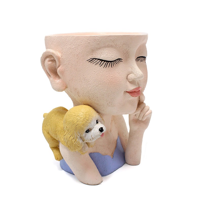 Side profile of resin girl face planter with closed eyes and yellow puppy on shoulder
