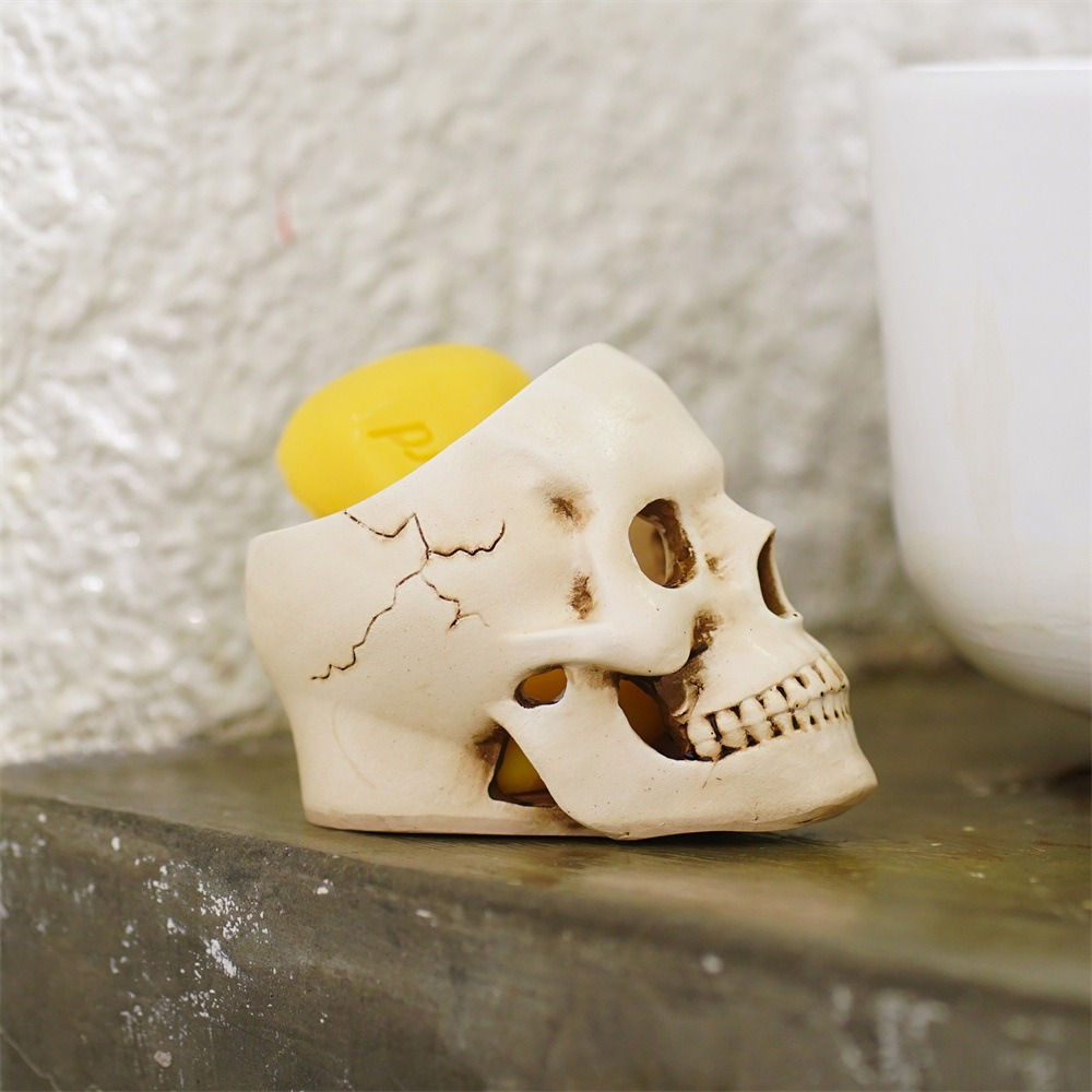 Close-up of a matte resin skull with sculpted teeth and eye sockets