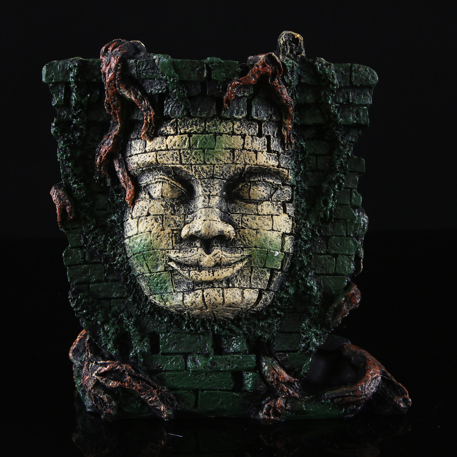 Resin sunken temple ornament photographed in a bare aquarium setting