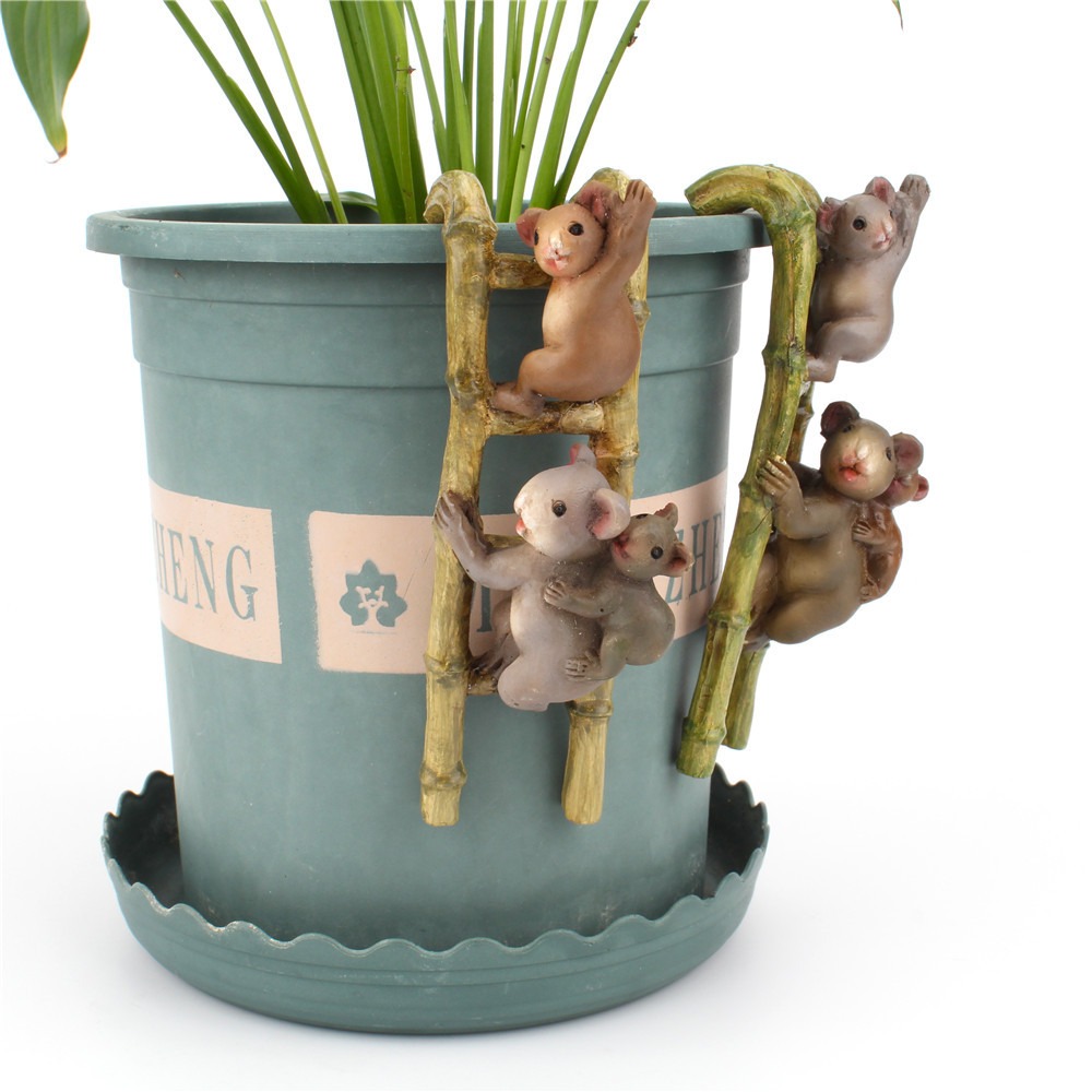 Mug and plant sitting on a plain desk with no decoration