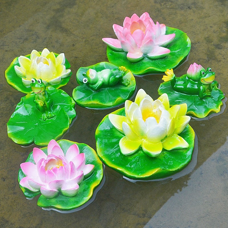 Glossy floating lily pad resting on calm pond water