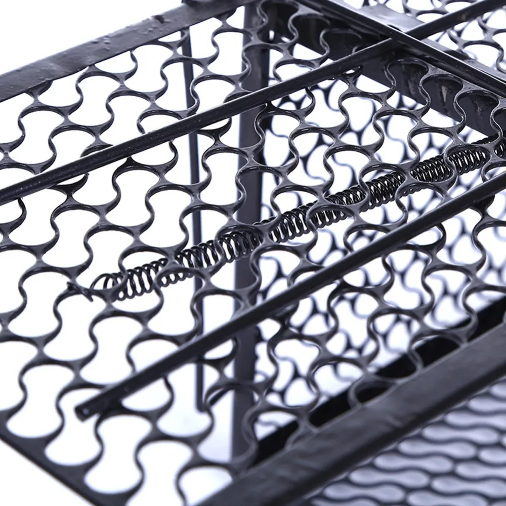 Close-up of coated wire mesh and exposed spring trigger mechanism