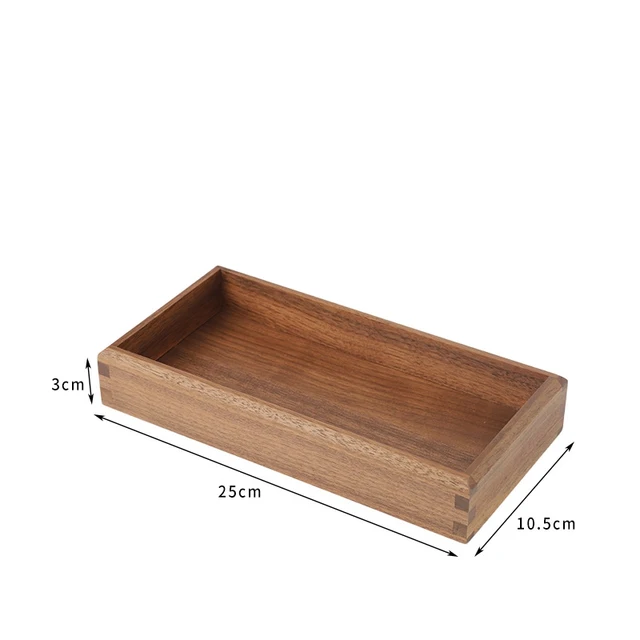 Calm vanity with a walnut tray holding jewelry and cosmetics