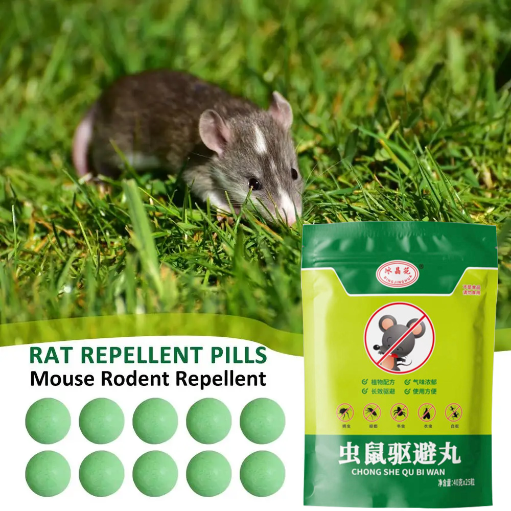 Pouch and ten green balls beside a rat in grass