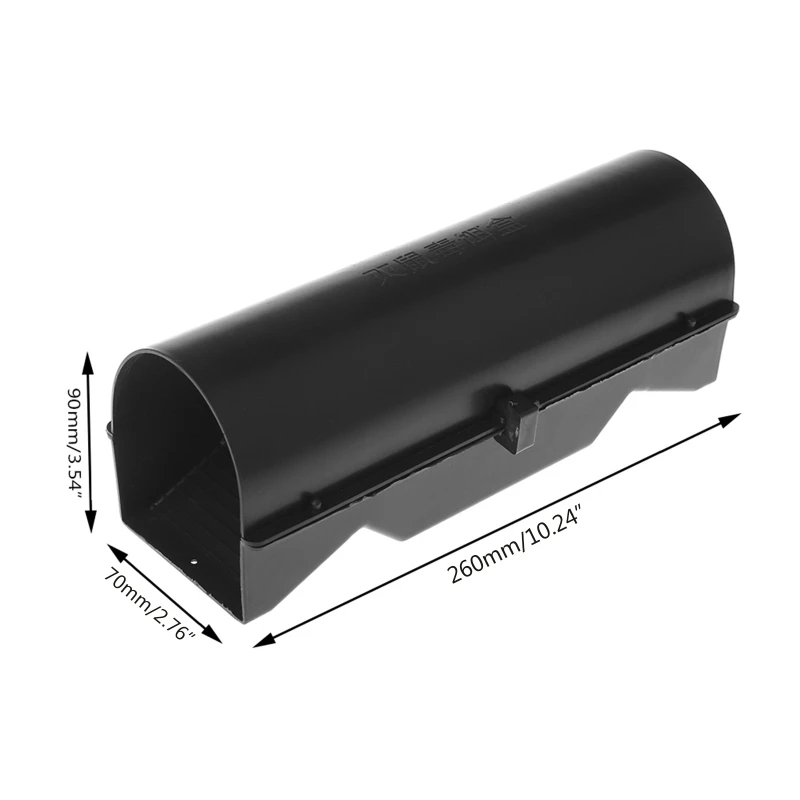 Matte black bait station photographed in a neutral setting