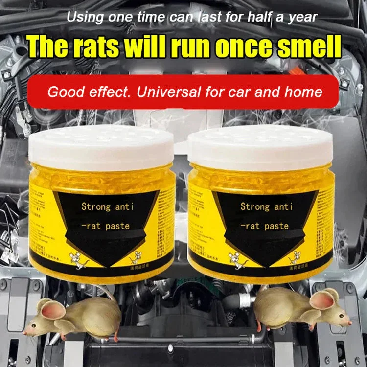 Two amber repellent jars set in front of a car engine bay
