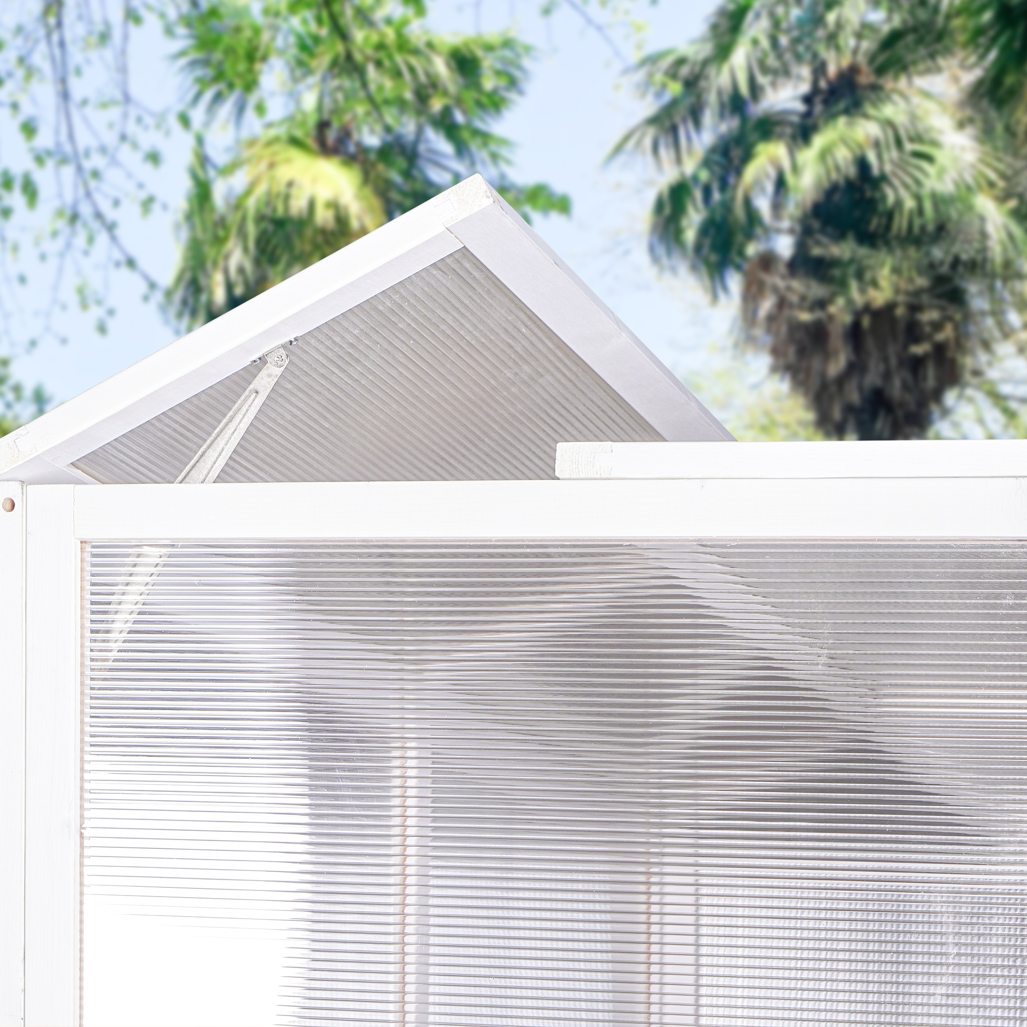 Close-up of clear ribbed polycarbonate panels and white painted roof frame