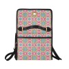 Women's lock bag with black shoulder strap, featuring a colorful geometric pattern design, ideal for work or travel.