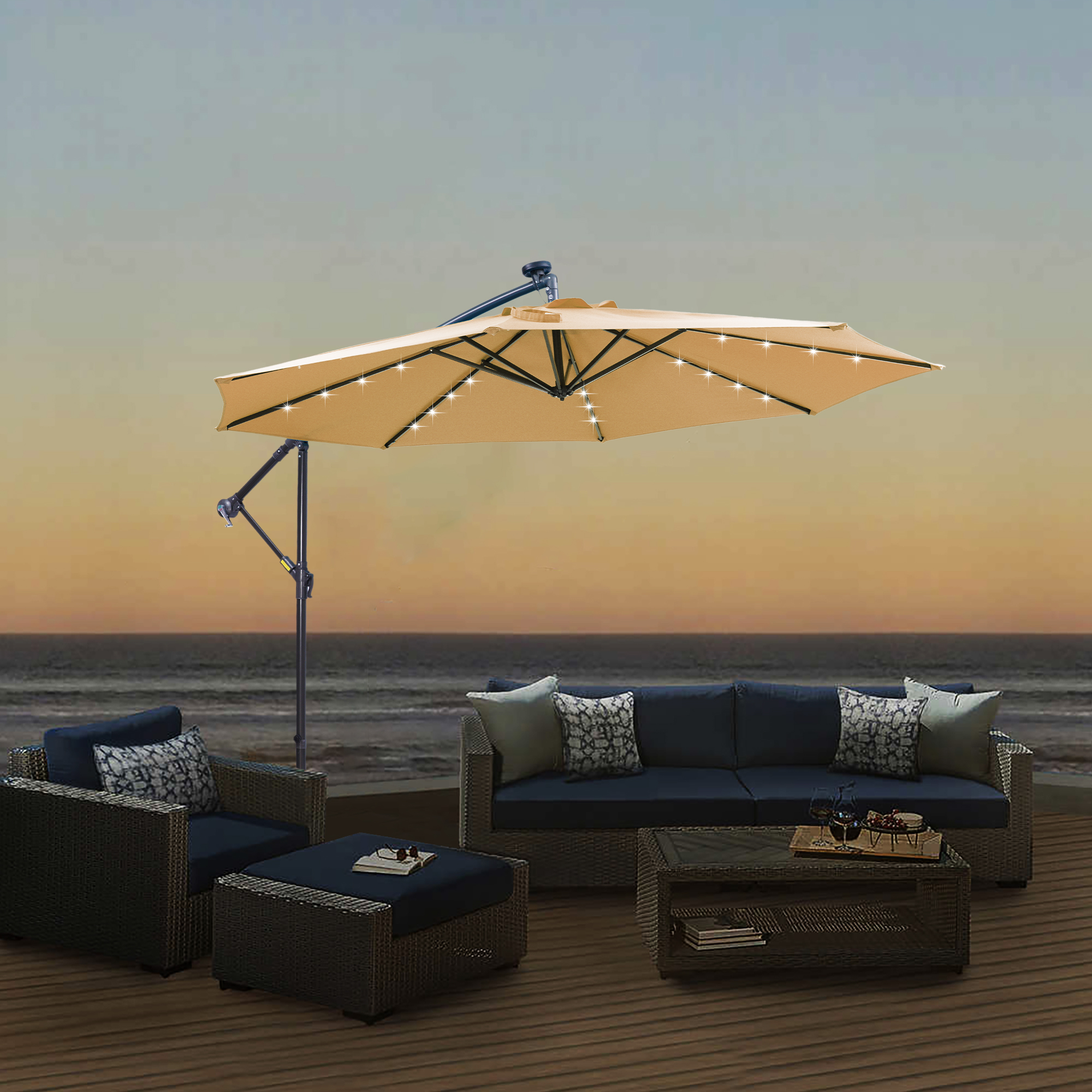 Taupe LED umbrella over a wicker sofa set on deck at dusk