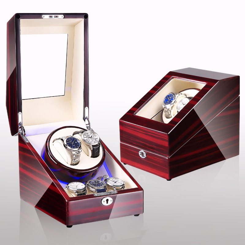 Wooden watch case with blue LED glow on a bedroom dresser