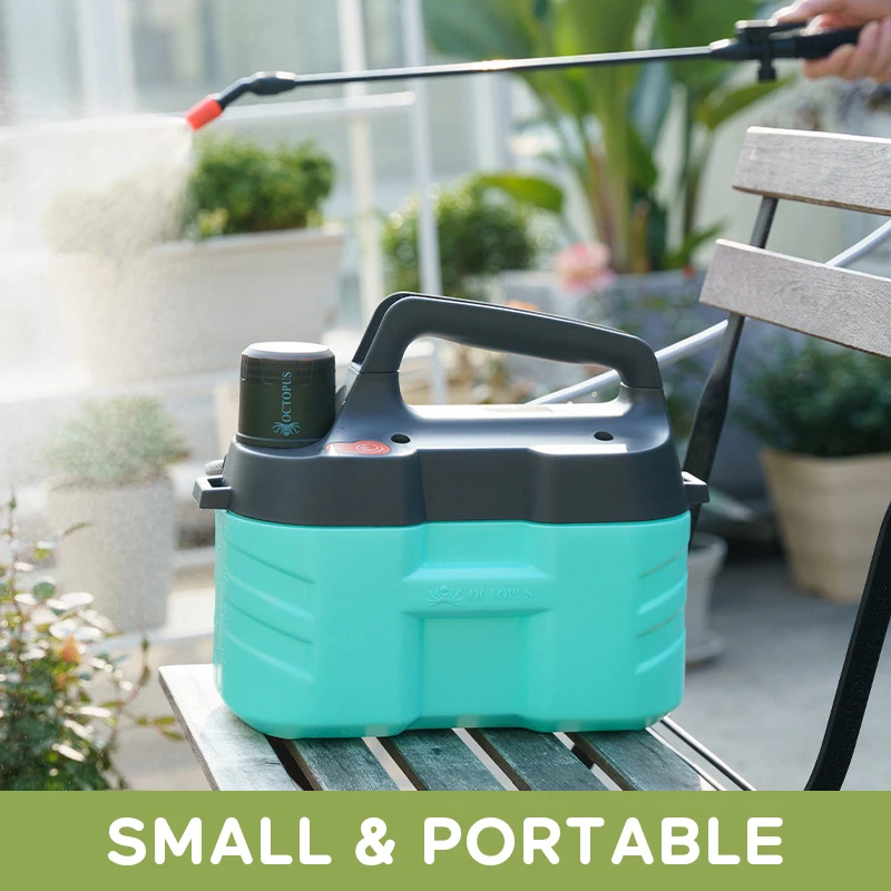 Sprayer on a sunny garden patio with mist over potted plants