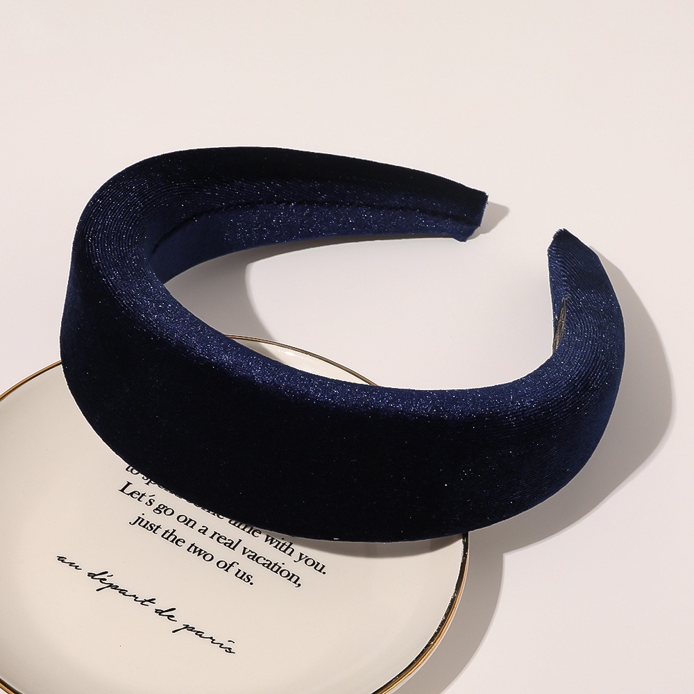 Navy velvet headband showing rounded padded crown shape