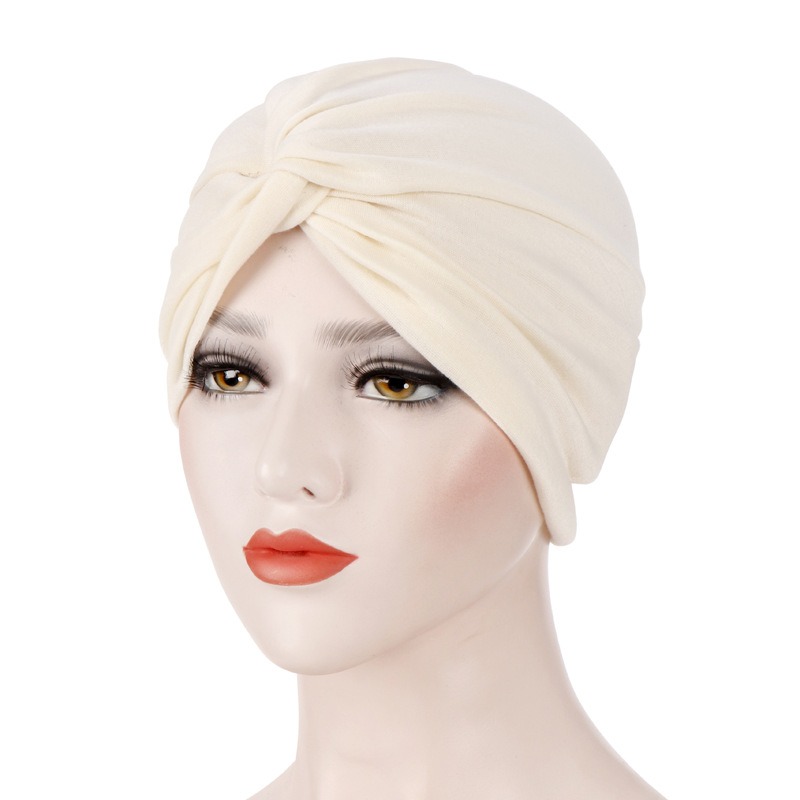 Ivory cream turban with prominent crossed front
