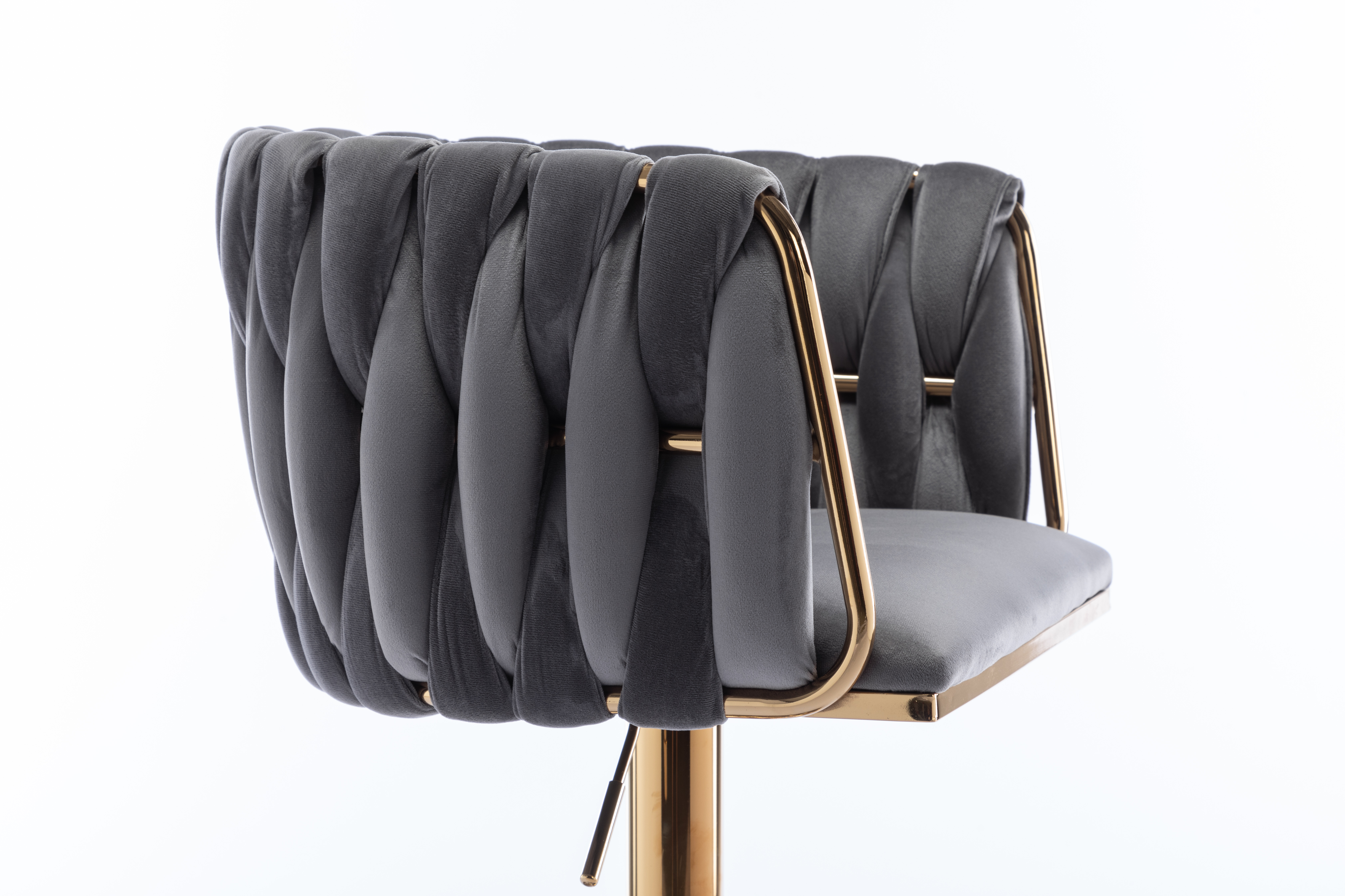 Close-up of woven grey velvet backrest and gold arms