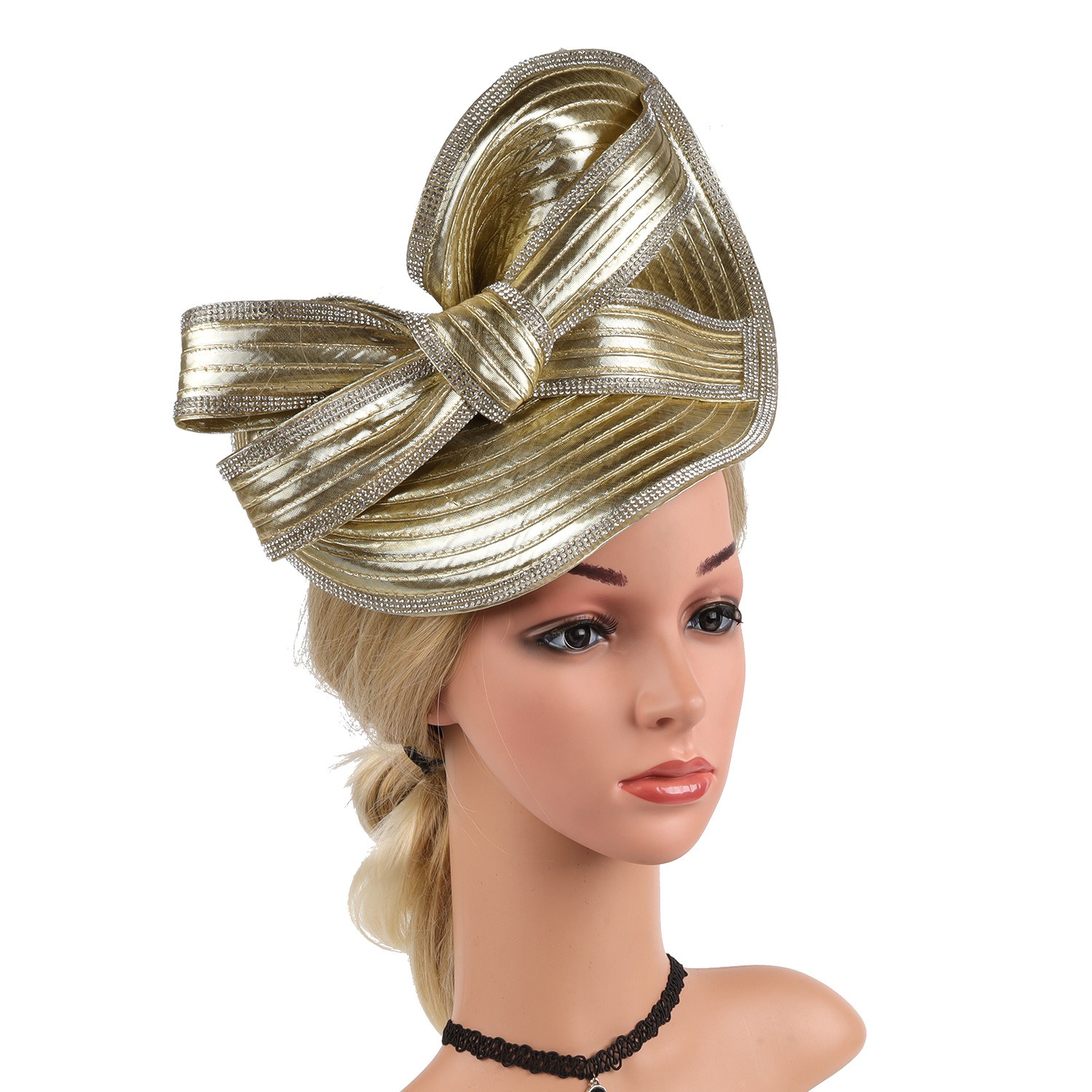 Champagne-gold fascinator highlighting its large decorative bow