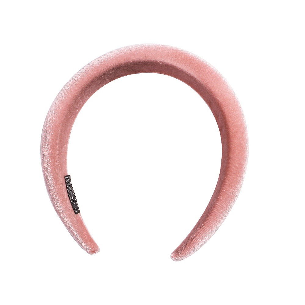 Blush pink headband showing tapered curved ends