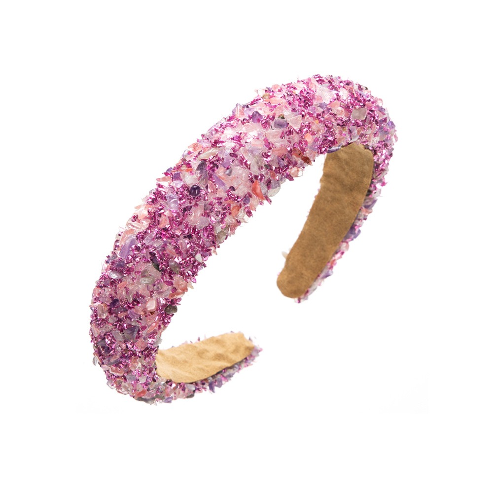 Pastel crystal embellishment across padded headband