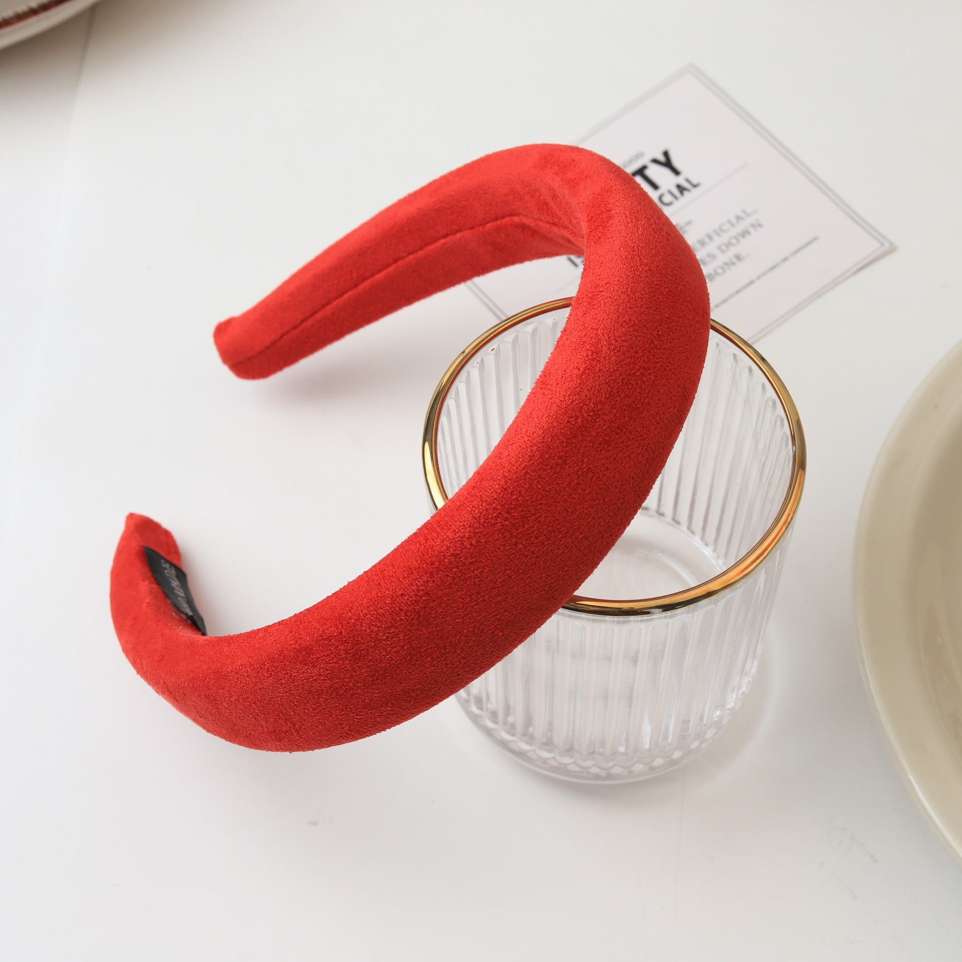 Bright red velvet headband styled with decor