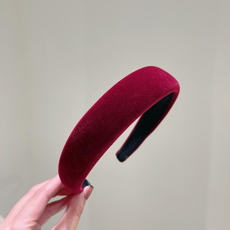Burgundy velvet headband showing wide rounded padding