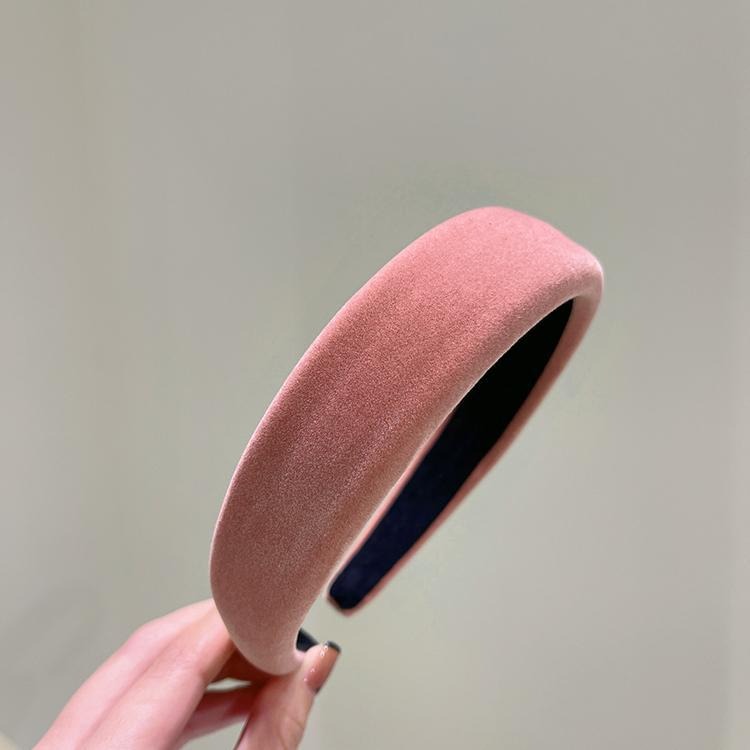 Blush pink velvet headband showing plush matte texture