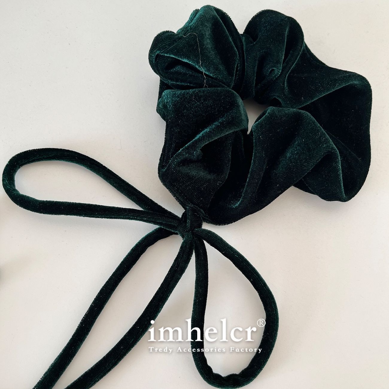 Deep teal velvet bow showing versatile statement styling