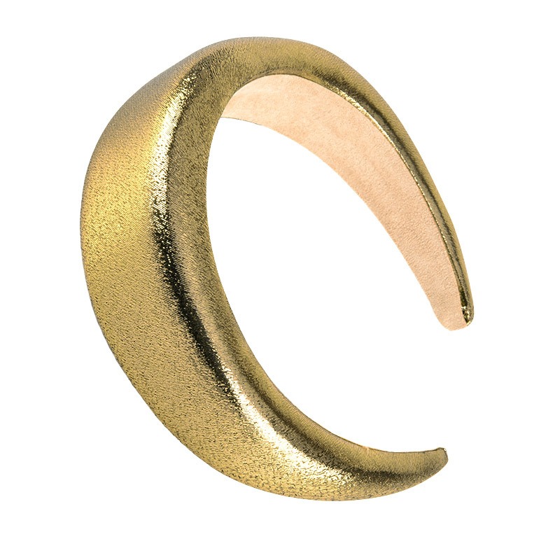 Gold hoop close-up showing soft contrasting inner lining