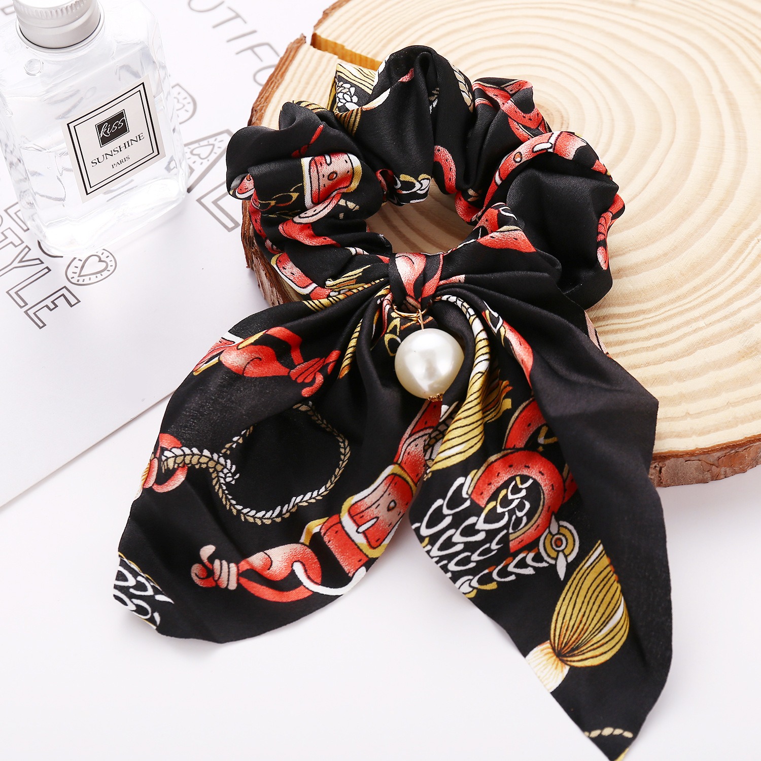 Oversized printed bow showing layered volume