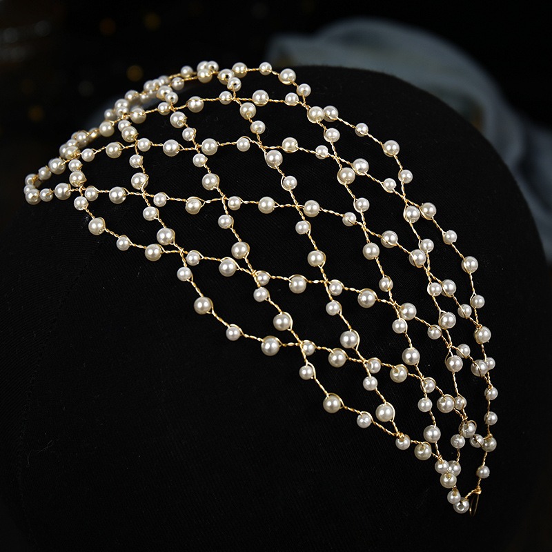 Open lattice construction with cascading pearl detail