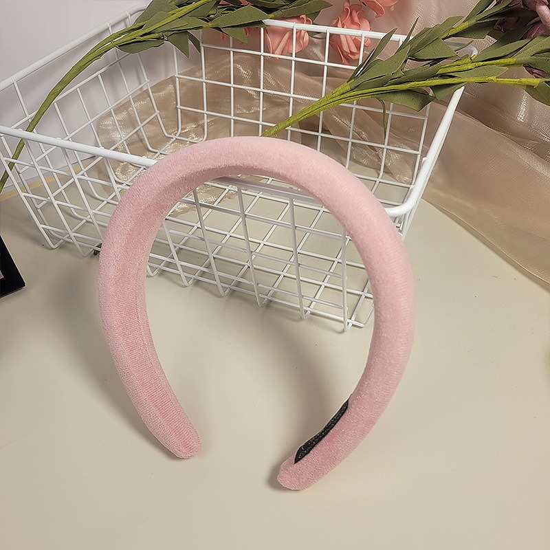 Blush pink headband showing matte plush velvet texture
