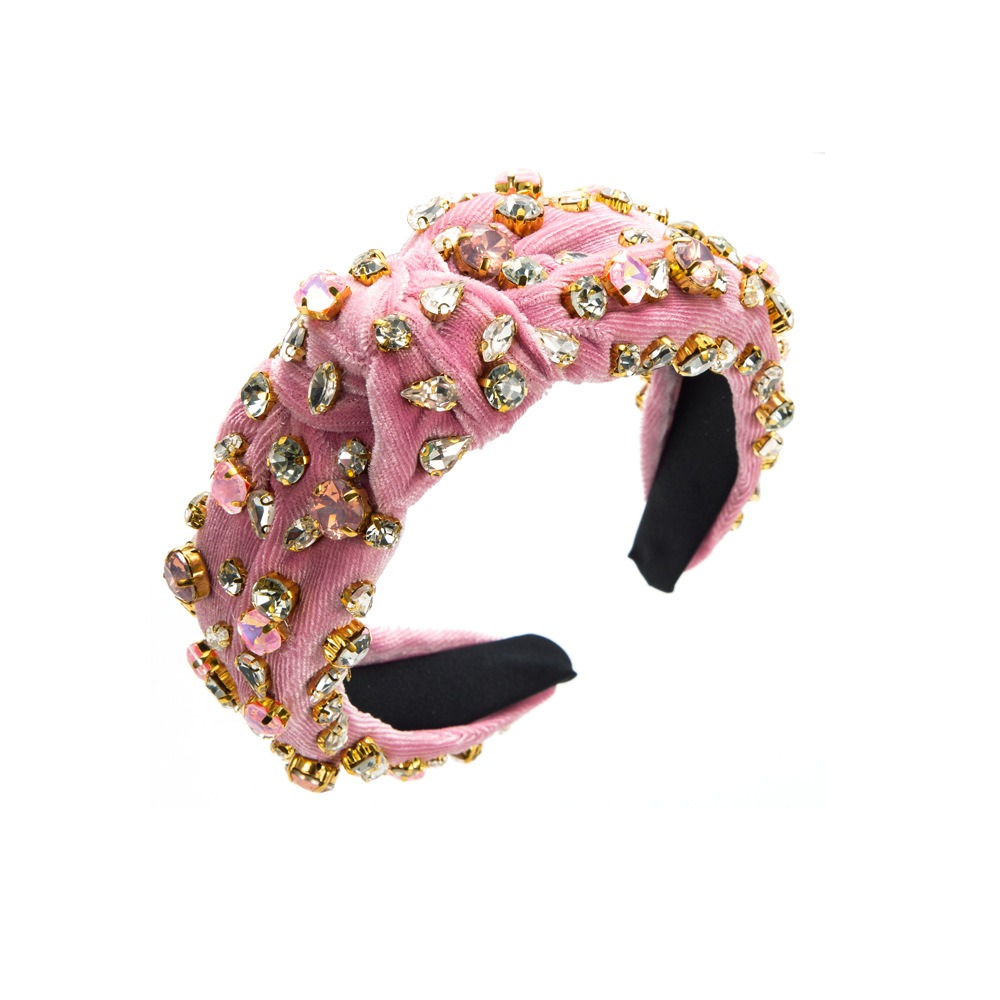 Pink velvet headband covered in faceted crystal stones