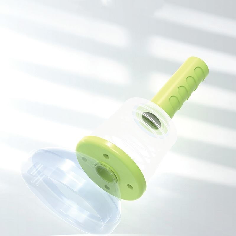 Exploded view of assembled device showing the lime-green pump separated from the clear silicone mask and white adapter ring