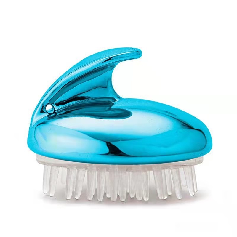 Sky blue metallic scalp massage brush with clear silicone bristles on white background