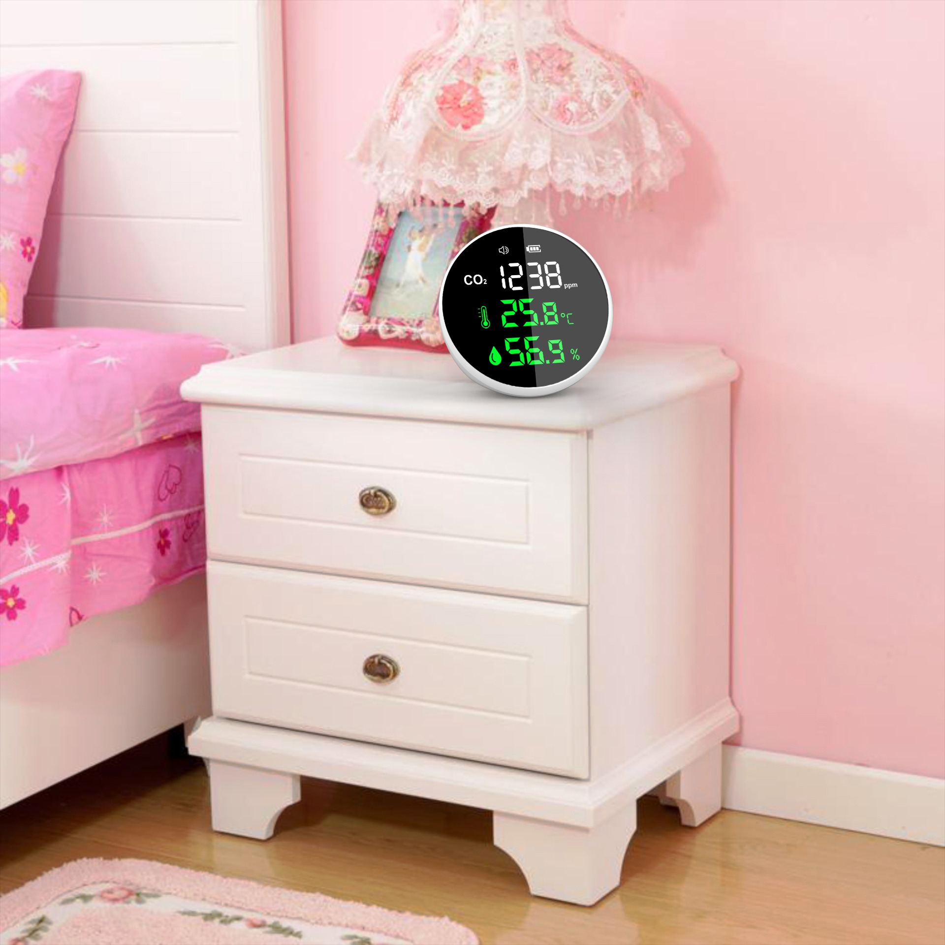 Monitor on a bedside table with its live readings clearly legible