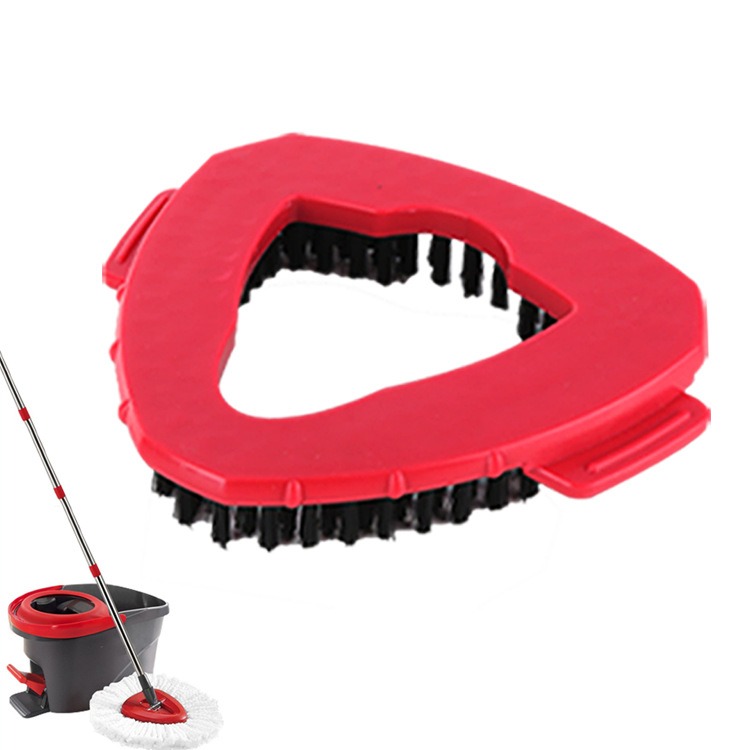 Triangular red replacement head beside mop handle