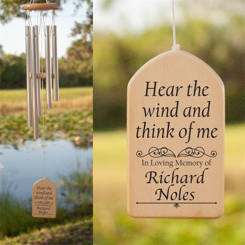 Wood memorial pendant with name engraving on a light background