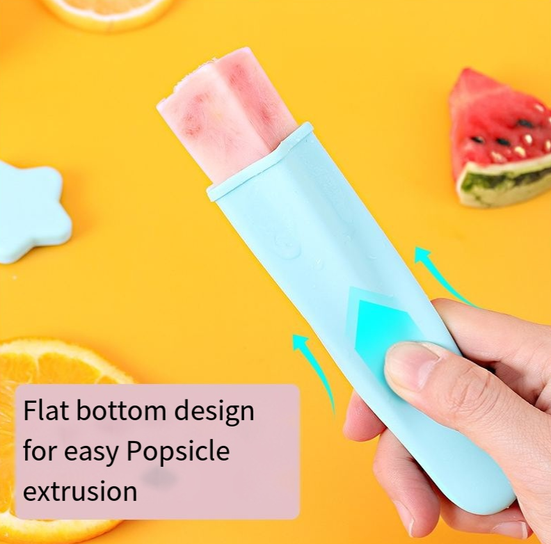 Hand pushing a frozen pop out of a blue mold from the flat bottom