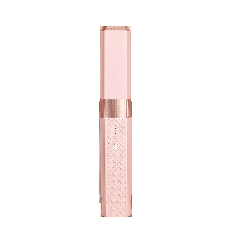 Close-up of textured blush pink styling grip