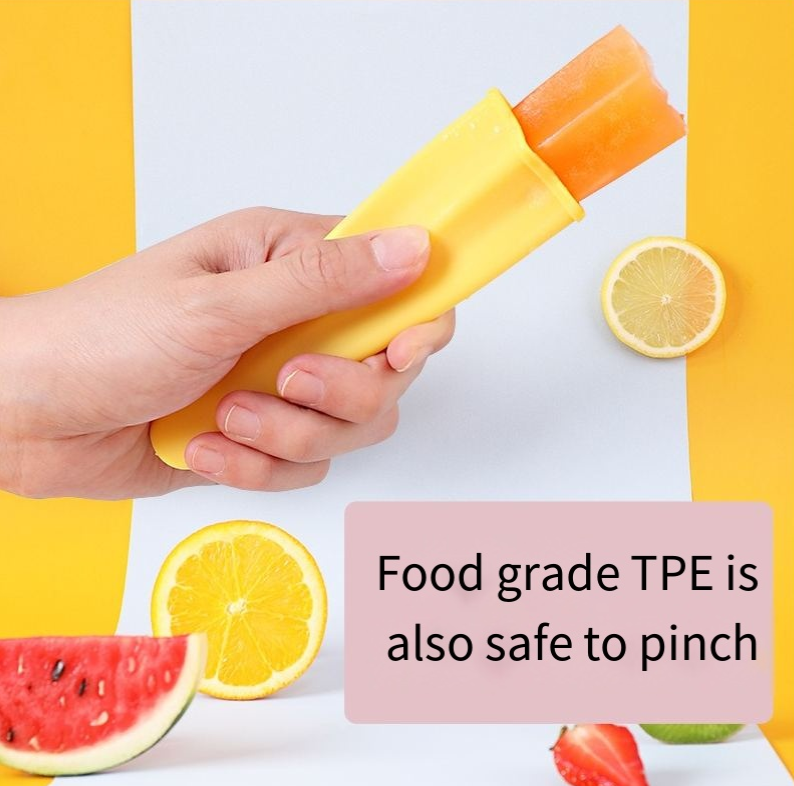 Hand squeezing a yellow silicone mold to show its soft flexible body