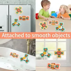 Spinner toys attached to bathtub tile and mirror surfaces