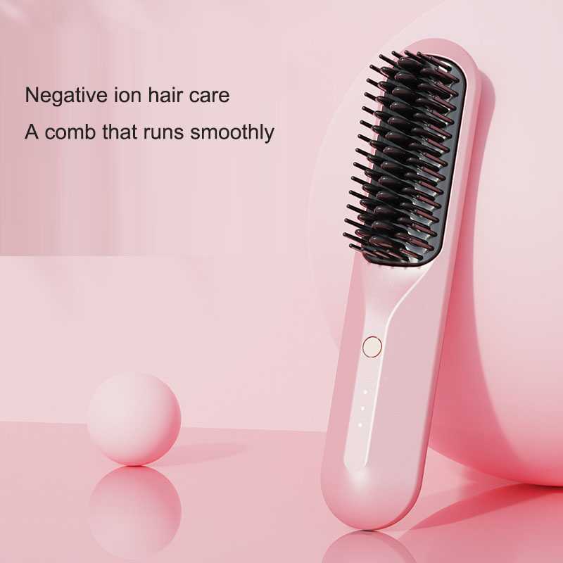 Pink heated comb angled showing dense teeth and negative ion care text