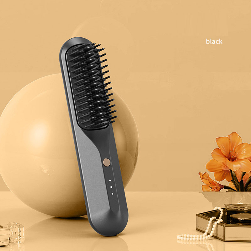 Black portable heated comb with single control button and three indicator lights
