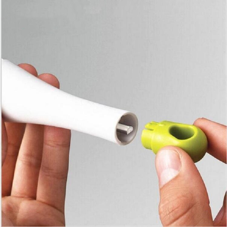 White handle separated from lime-green beater end