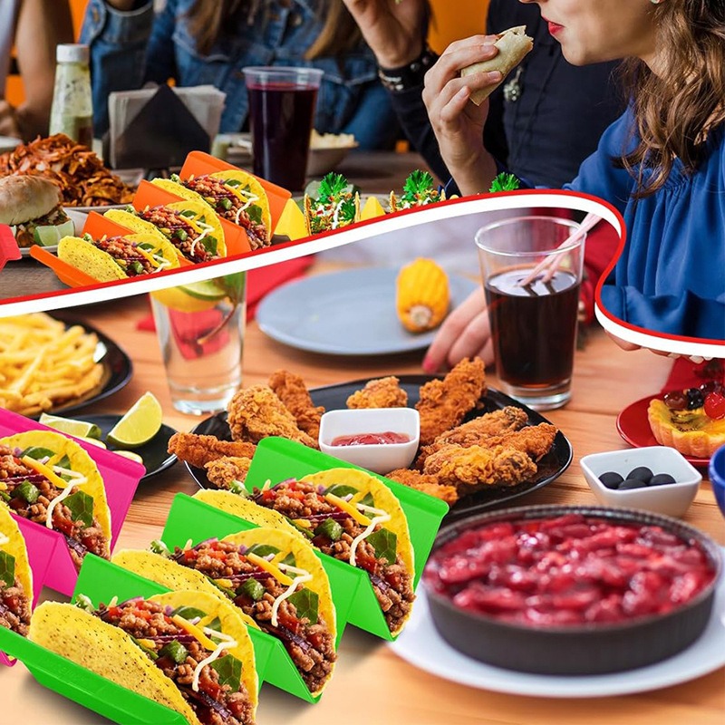 Colorful holders keeping multiple tacos upright at dinner