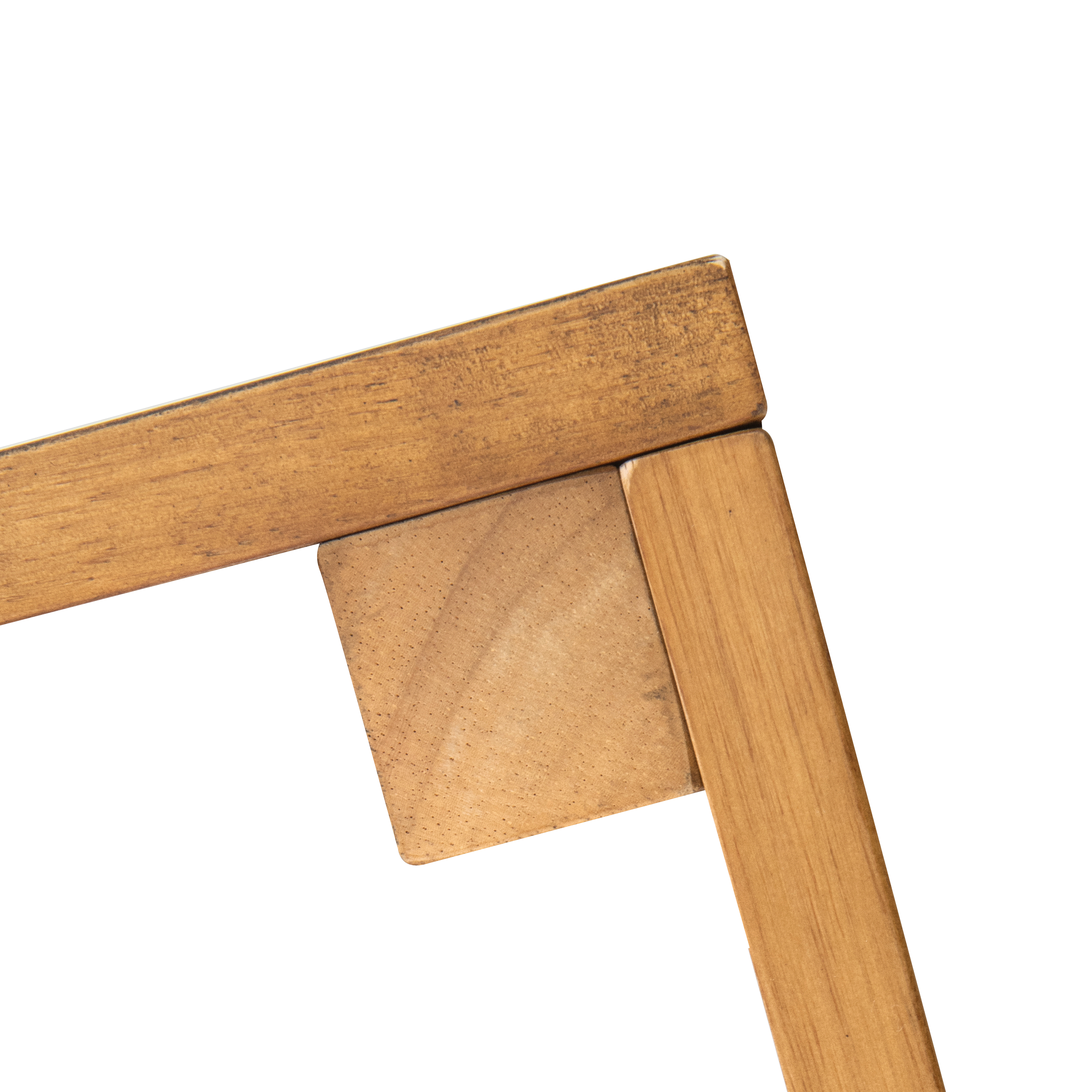 Corner joint where wood rail meets square leg