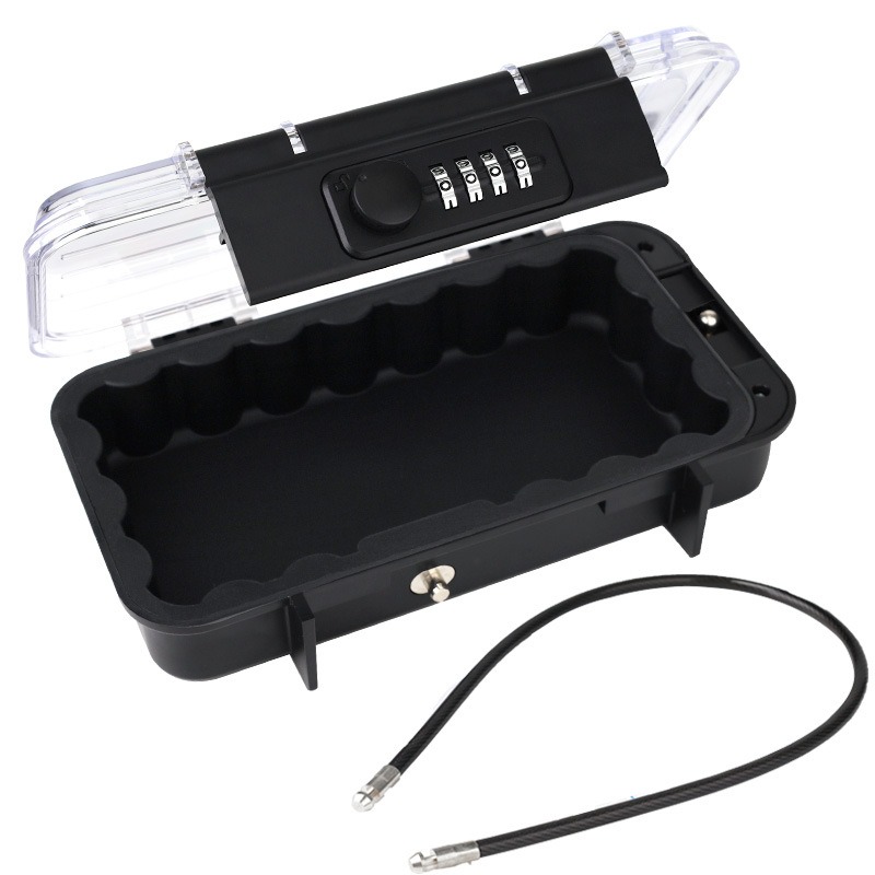 Black storage box with clear lid showing the combination dial and foam lining