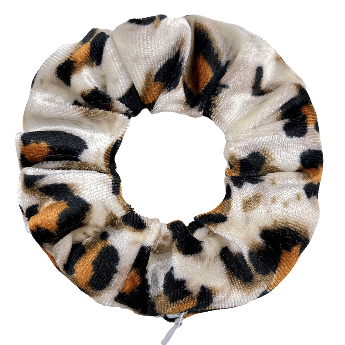 Close-up of plush gathered leopard velvet texture